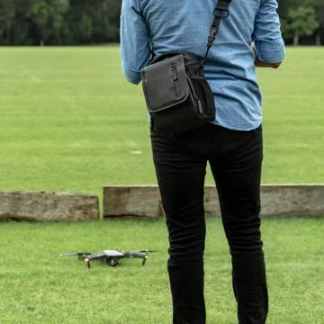 Learning to fly a drone. New technologies require a learning period. Masterin Stock Photos