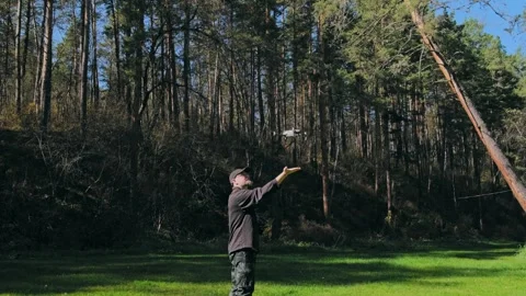 Learning to fly a drone in a park. Stock Footage 305031997
