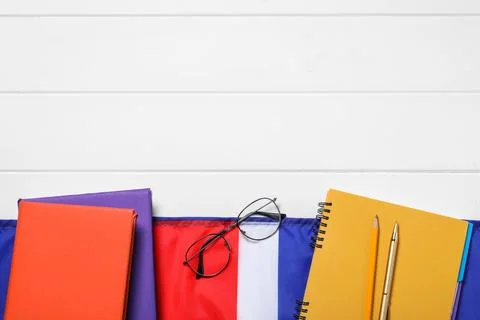 Learning foreign language. Flag of United Kingdom, books, stationary and gl.. Stock Photos