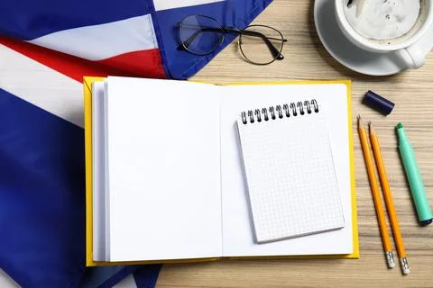Learning foreign language. Open book, flag of United Kingdom, stationery an.. Stock Photos