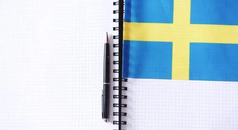 Learning foreign languages. Notepad for entries and a flag. Lang Stock Photos