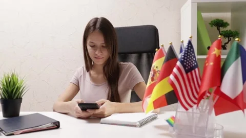 Learning foreign languages, student with a phone app, online language cours.. Stock Footage 255441197