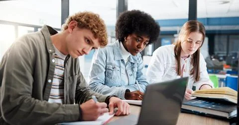 Learning, group and students with laptop, classroom and research for assignment Stock Photos