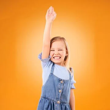 Learning, hands raised and happy kid with question in studio isolated on an Stock Photos