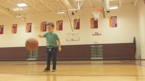 Learning how to dribble a basketball Stock Footage 86760648