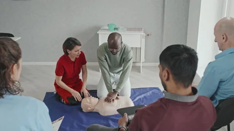 Learning How To Perform Heart Massage Stock Footage 223930637