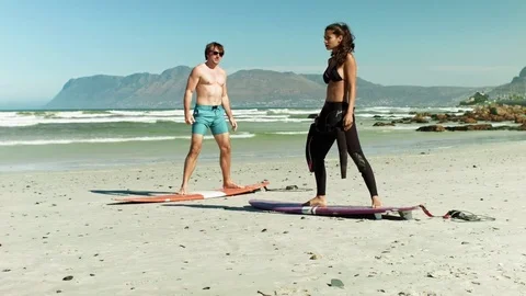 Learning how to surf in summer Stock Footage 76521621