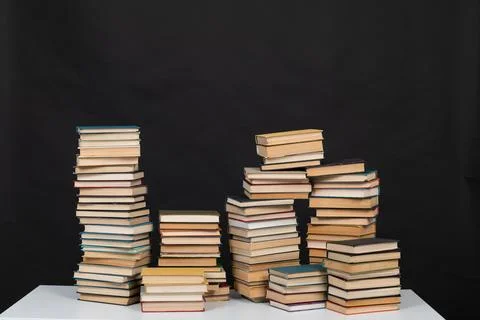 Learning library science stack of books on a black background 写真素材