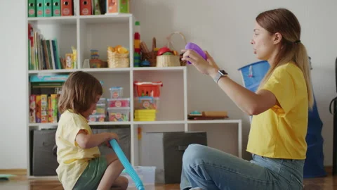 Learning is made joyful with a private female therapist. This kid overcomes Stock Footage 250152437