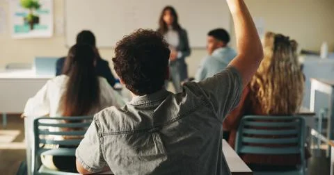 Learning, man and raised hand for question in college, knowledge and development Stock Photos