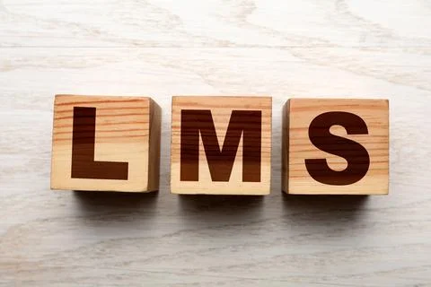 Learning management system. Cubes with abbreviation LMS on wooden backgroun.. Stock Photos