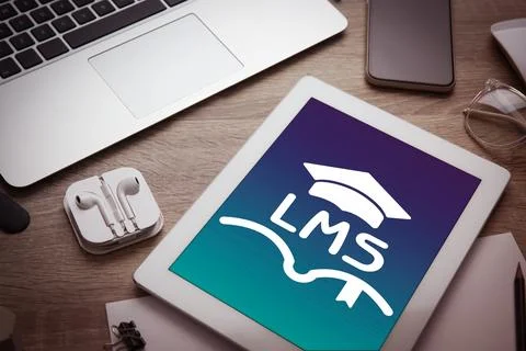 Learning management system. Tablet with open book and graduate cap icons wi.. Stockfoto's