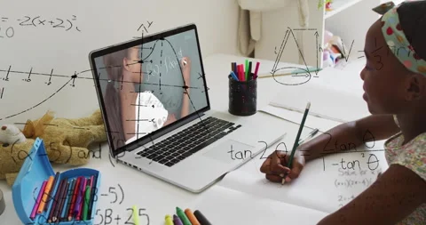 Learning math online, child using laptop with animation of equations in school Stock Footage 303528075