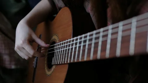 Learning music at home, cinematic. classical guitar detail Video stock 278034005