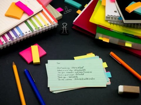 Learning New Language Writing Words Many Times on the Notebook; Thai Stock Photos