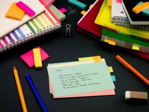 Learning New Language Writing Words Many Times on the Notebook; French Foto stock