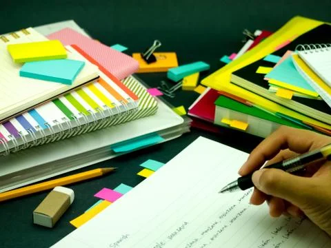 Learning New Language Writing Words Many Times on the Notebook; Spanish Stock Photos