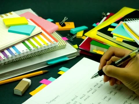 Learning New Language Writing Words Many Times on the Notebook; Portuguese Stock Photos
