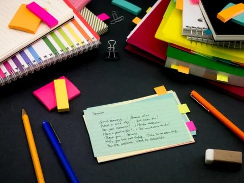 Learning New Language Writing Words Many Times on the Notebook; Spanish Stock Photos