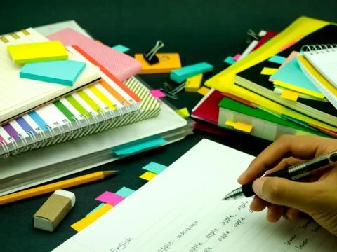 Learning New Language Writing Words Many Times on the Notebook; English Stock Photos