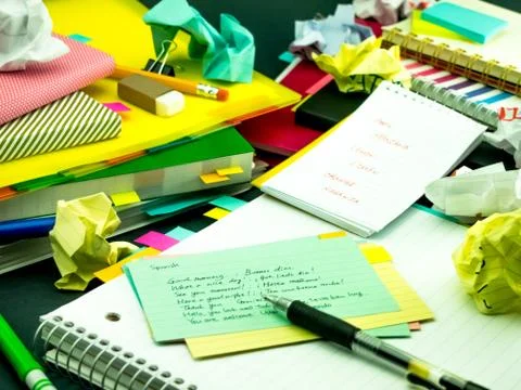 Learning New Language Writing Words Many Times on the Notebook; Spanish Stock Photos