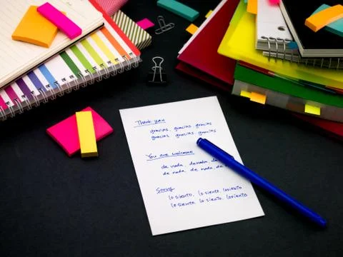 Learning New Language Writing Words Many Times on the Notebook; Spanish Stock Photos