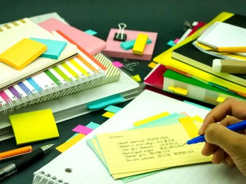 Learning New Language Writing Words Many Times on the Notebook; Korean Stock Photos