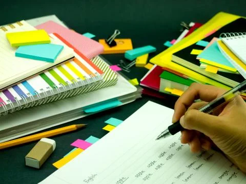 Learning New Language Writing Words Many Times on the Notebook; English Stock Photos