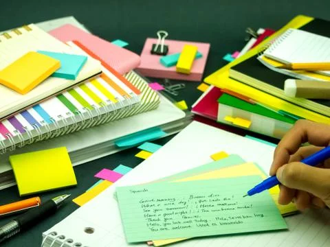 Learning New Language Writing Words Many Times on the Notebook; Spanish Stock Photos