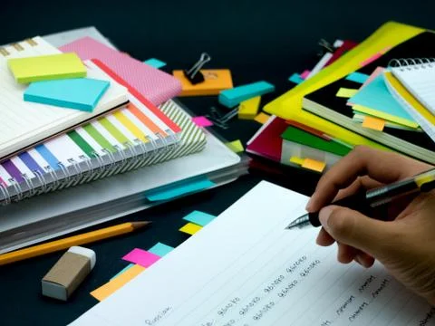 Learning New Language Writing Words Many Times on the Notebook; Russian Stock Photos
