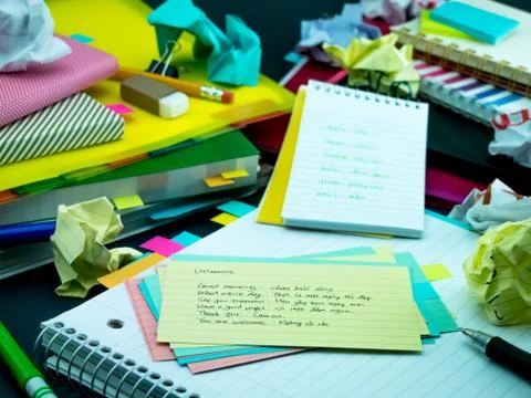 Learning New Language Writing Words Many Times on the Notebook; Vietnamese Foto stock