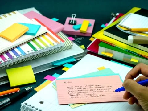 Learning New Language Writing Words Many Times on the Notebook; Russian Stock Photos