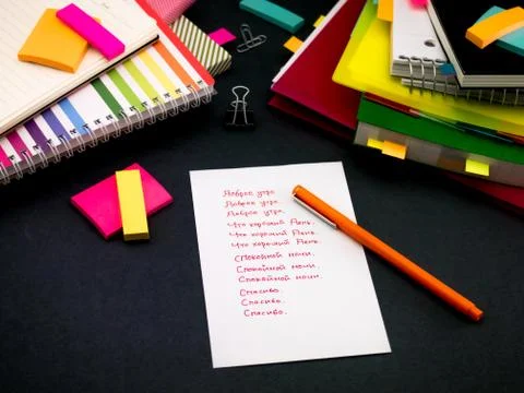 Learning New Language Writing Words Many Times on the Notebook; Russian Stock Photos