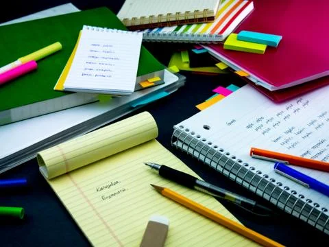 Learning New Language Writing Words Many Times on the Notebook; Greek Stock Photos