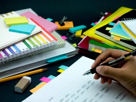 Learning New Language Writing Words Many Times on the Notebook; Greek Stock Photos