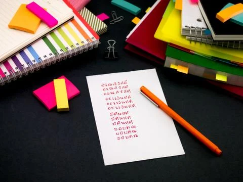 Learning New Language Writing Words Many Times on the Notebook; Thai Stock Photos