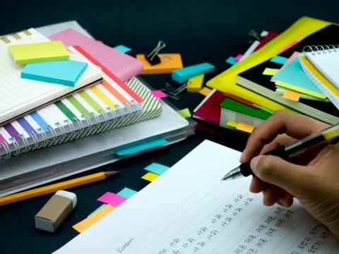 Learning New Language Writing Words Many Times on the Notebook; Korean Stock Photos