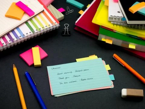 Learning New Language Writing Words Many Times on the Notebook; Ukrainian Stock Photos