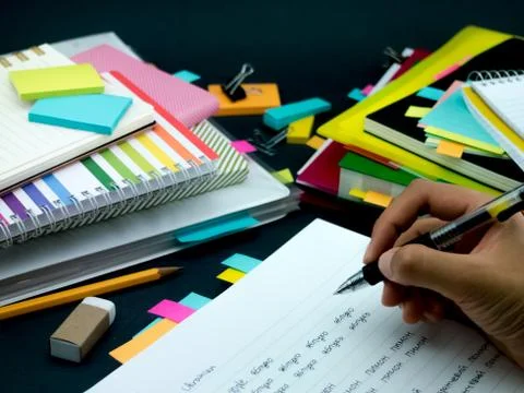 Learning New Language Writing Words Many Times on the Notebook; Ukrainian Stock Photos