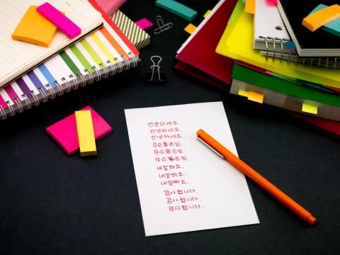 Learning New Language Writing Words Many Times on the Notebook; Korean Stock Photos
