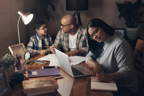Learning, night and remote work with family in home together for education .. Foto stock