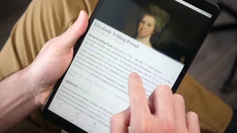 Learning Online Using Wikipedia app on a Tablet Screen Video stock 146998707