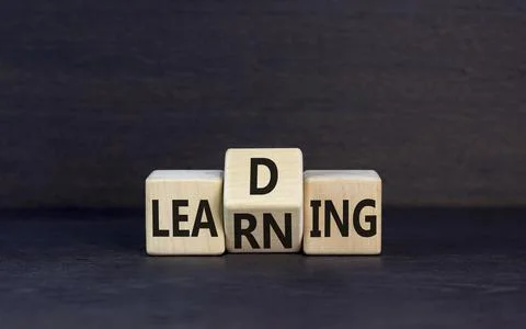 Learning or leading symbol. Concept words Learning Leading on wooden block... Stock Photos