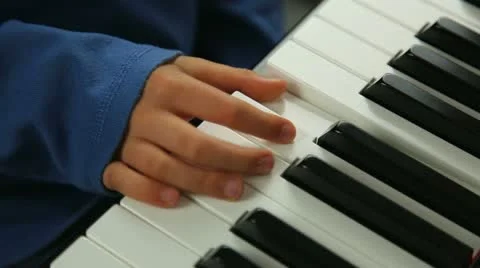Learning the piano Stock Footage 12185379