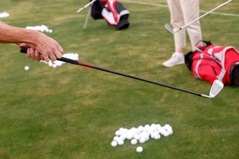 Learning to play Golf. Stock Photos