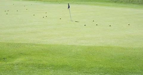 Learning to play golf in the spring 스톡 사진