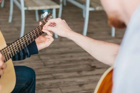 Learning to play the guitar. Music education. 스톡 사진
