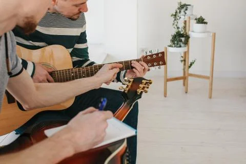 Learning to play the guitar. Stock Photos