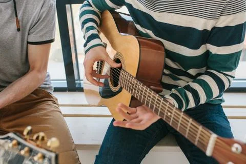 Learning to play the guitar. Stock Photos