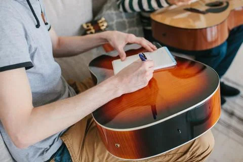 Learning to play the guitar. Stock Photos